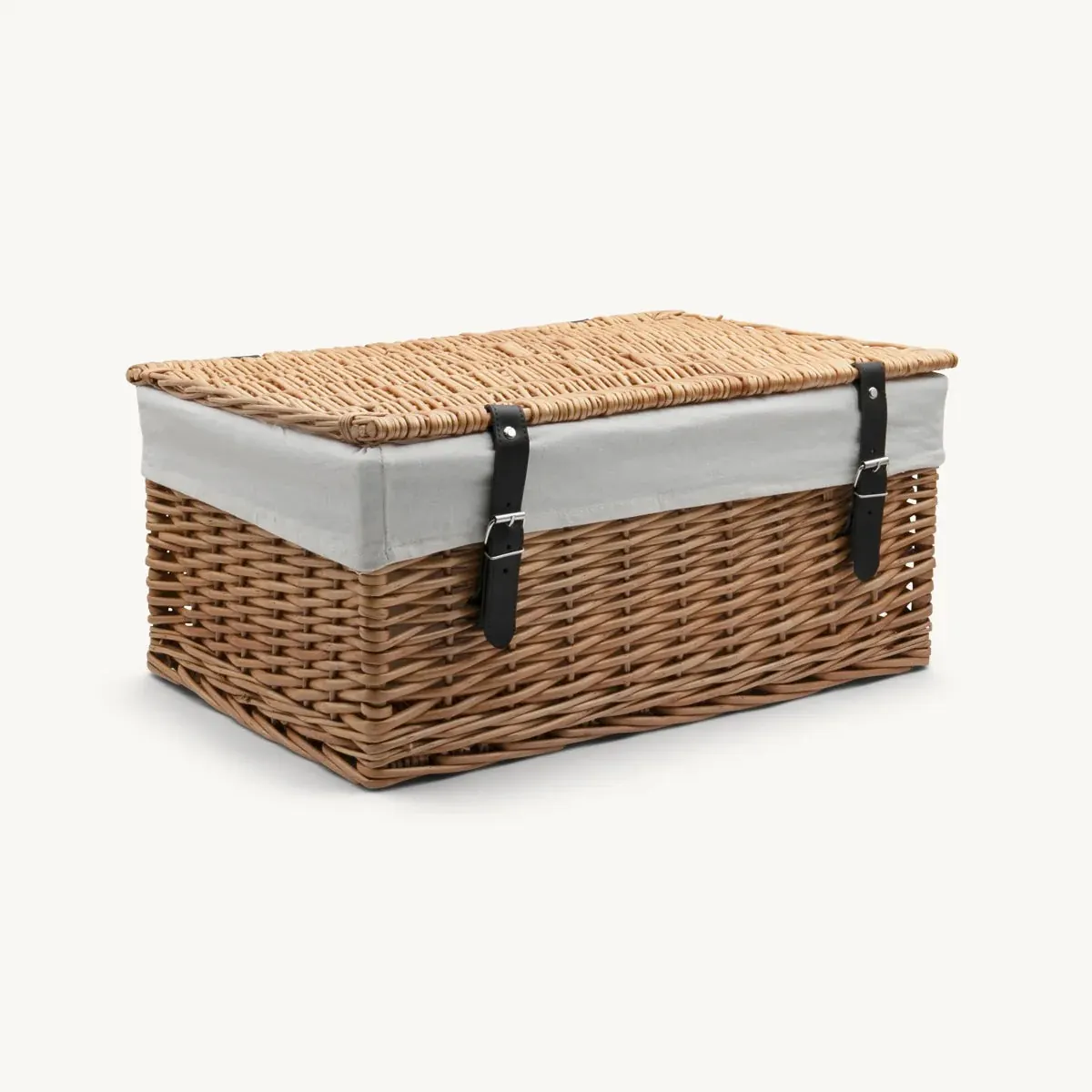 Large wicker hamper with cream lining and leather straps
