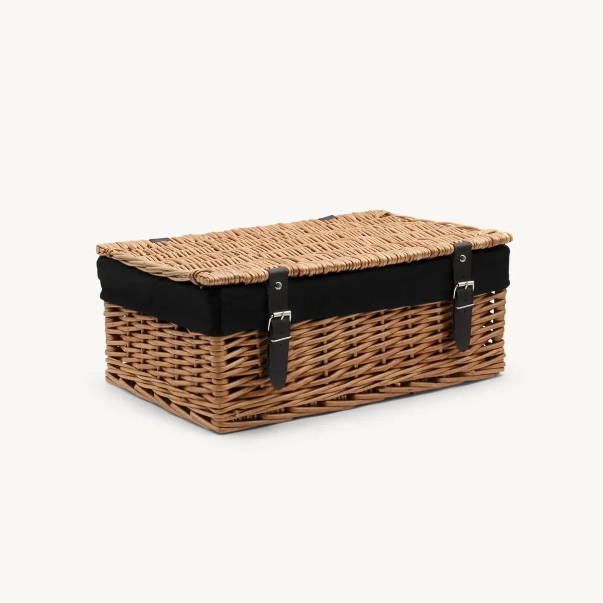 Medium wicker hamper with black lining and leather straps