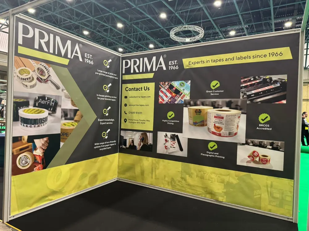 A shell-scheme stand with product photography