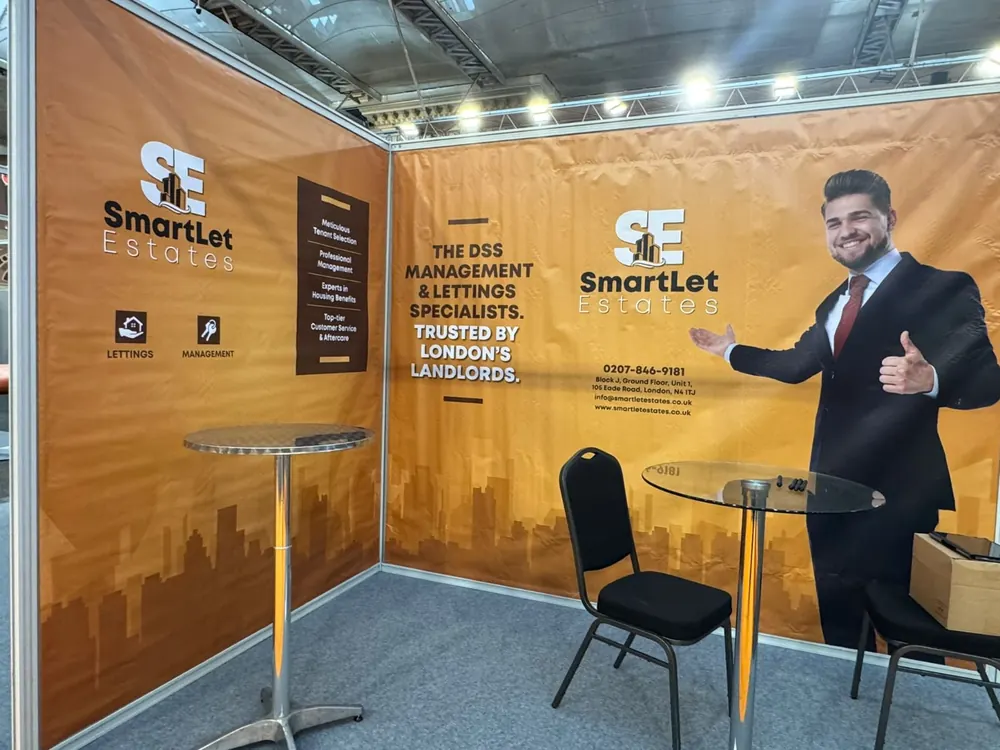 An orange shell-scheme stand for an estate agent