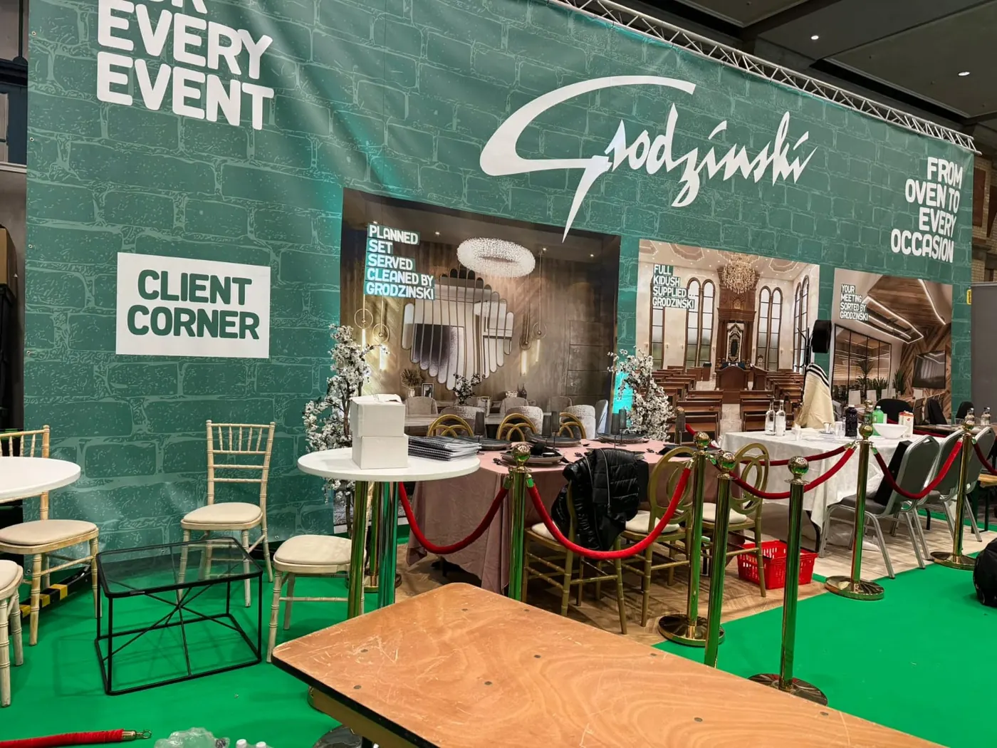 A large themed exhibition stand with a client seating area